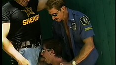 Two hunky policemen get their meat blown by a submissive sucker